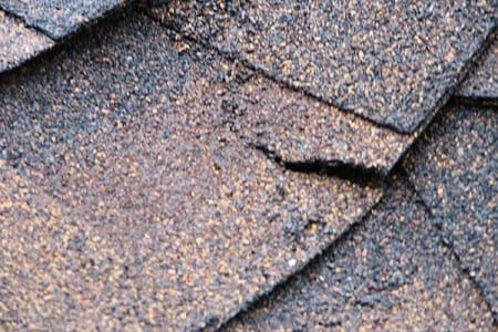 torn-roofing-shingles
